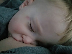 Laura's son, nursing.
